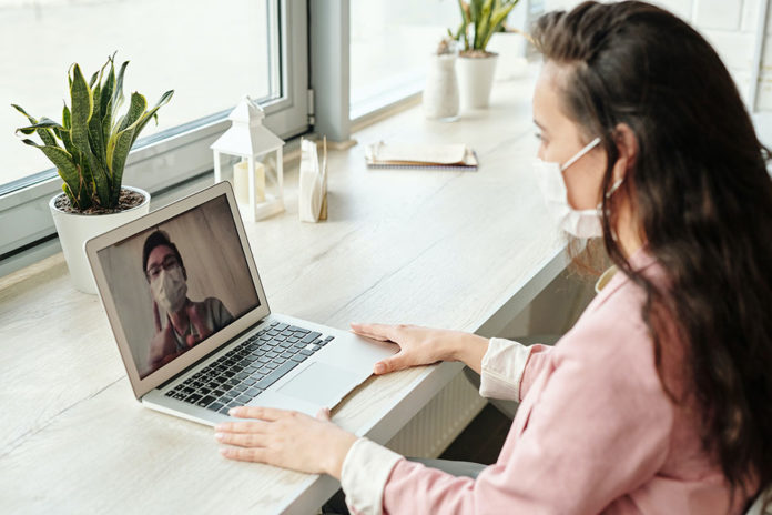 woman having a video call 4031818 696x464 1